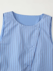 Detail of blue and white striped sleeveless top with unique diagonal button closure