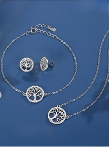 Detailed close-up of S925 sterling silver Tree of Life necklace, bracelet and earrings set