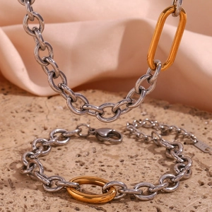 Minimalist stainless steel jewelry set with gold oval link and 18K necklace and bracelet