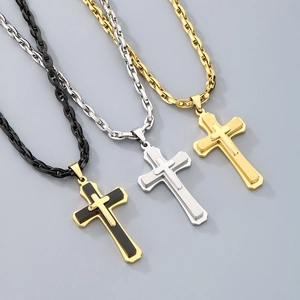 Detailed view of triple layered hip hop cross pendants in gold, silver, and black finishes