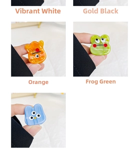 Detailed close-up of mini acetate hair clips in colorful cute cartoon character designs