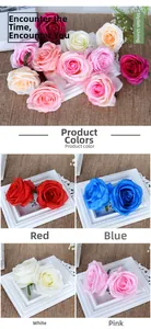 Detailed view of artificial silk rose flower heads in various vibrant colors for weddings