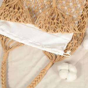 Detailed close-up of hollow cotton rope weave and white drawstring liner on the bag