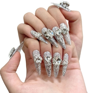 Luxury long stiletto press-on nails with silver glitter, 3D rhinestones and metal butterflies