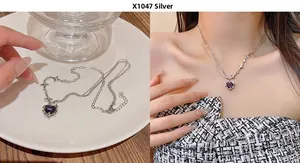 Close-up of double-layer silver necklace with purple heart pendant and zircon star
