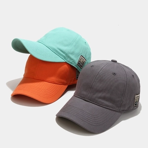 Detail of multi-color cotton twill baseball caps with vintage side patch and stitching