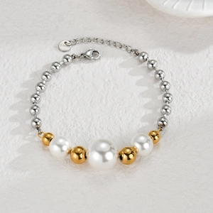 Detail of stainless steel beaded bracelet with pearls and adjustable lobster clasp