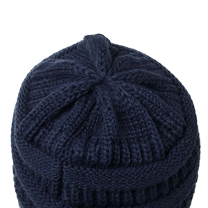 Navy blue ribbed knit beanie hat for women featuring a minimalist crown stitch design