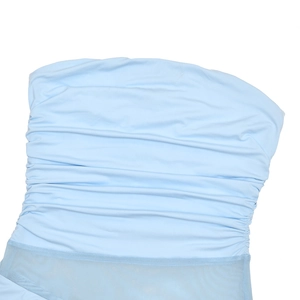 Detailed close-up of light blue pleated fabric and mesh texture on a strapless dress
