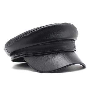 Detailed view of the black PU leather baker boy hat showing premium texture and stitching