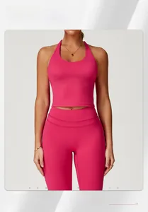 Detailed back view of a rose red criss-cross yoga sports bra and high waist gym leggings