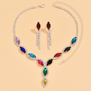 Detail of bridal jewelry set with multicolored marquise rhinestones and drop earrings
