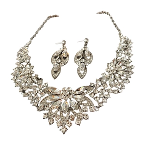 Silver crystal flower necklace and drop earrings luxury jewelry set on white background