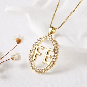 Elegant gold FE letter oval pendant necklace with white cubic zirconia micro-inlay
