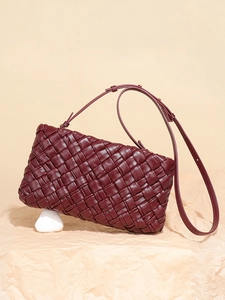 Elegant wine red woven leather shoulder bag with fine texture and gold hardware