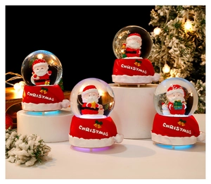 Detail view of four Christmas snow globes with glowing Santa Claus on geometric stands