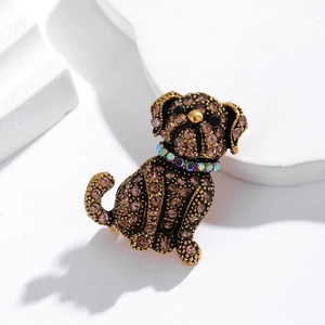 Retro bulldog brooch with brown crystals and colorful collar on a white display pedestal