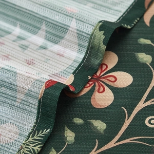 Dark green Christmas tablecloth with beige floral pattern and textured fabric finish