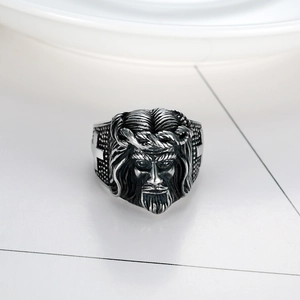 Vintage stainless steel ring with embossed bearded male portrait and cross detail