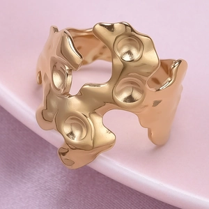 Macro shot of 18K gold plated stainless steel ring with liquid lava texture and dimples