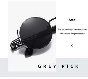 Detail of round punk sunglasses featuring hollow architectural metal frame and black lenses