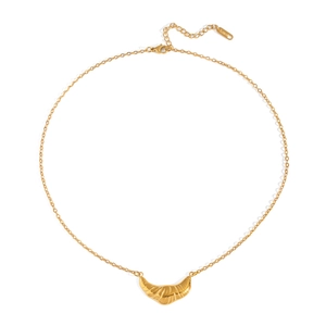 Detailed close-up of a gold-plated stainless steel croissant pendant on a fine chain