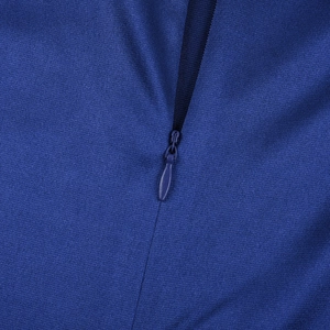 Macro detail of high-quality invisible zipper on dark blue satin evening dress fabric