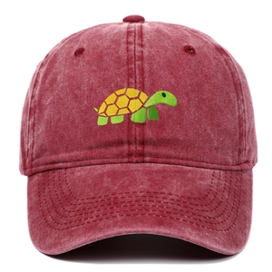 Detail of embroidered sea turtle on wine red washed cotton vintage baseball cap