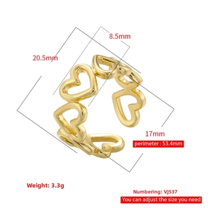 Detailed view of golden heart cutout ring showing dimensions and adjustable open design