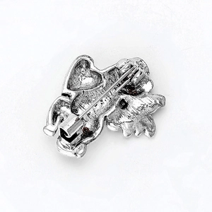 Detailed back view of vintage silver alloy angel dog brooch with secure safety pin