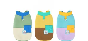 Detail of warm fleece dog vests featuring leash D-rings and decorative pockets