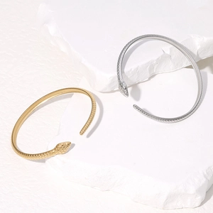 Minimalist snake-shaped stainless steel open bracelet with scale texture in gold and silver