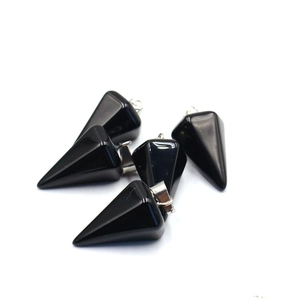 Detailed close-up of five polished black onyx hexagonal cone pendants with silver clips