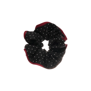 Black polka dot fabric scrunchie with red piping and elegant ruffled design