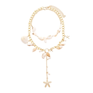 Two-layer bohemian ocean necklace with gold starfish, natural shells, and pearls