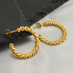 Chic 18k gold plated stainless steel twisted hoop earrings on stone background
