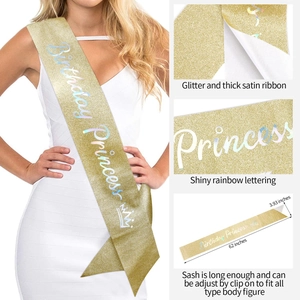 Detail of glitter gold Birthday Princess sash with iridescent rainbow lettering