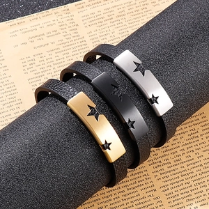 Detailed view of men's punk leather bracelet with star hollow metal plate on stand