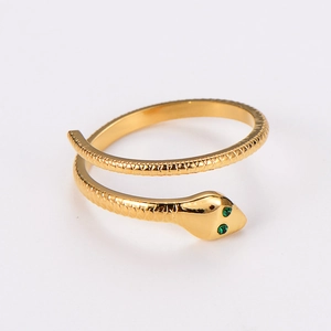 Detailed view of snake ring with green stone eyes and golden scales texture