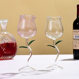 Romantic rose-shaped crystal wine glasses with creative green vine stems and leaf base