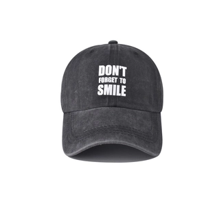 Detail of washed charcoal cotton baseball cap with Don't Forget to Smile embroidery