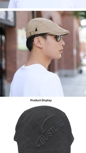 Detail of quilted cotton beret cap with metal buckle and Bustling 3D embroidery