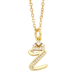 Detail of gold letter Z pendant with crown design and shimmering cubic zirconia stones