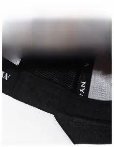 Detail of the moisture-wicking sweatband inside a black baseball cap with durable stitching