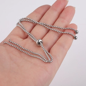 Detailed view of 1.8mm stainless steel box chain with adjustable bolo slider bead on hand