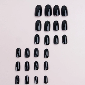 Glossy black oval press-on nails set with 22 pieces of various sizes on pink background