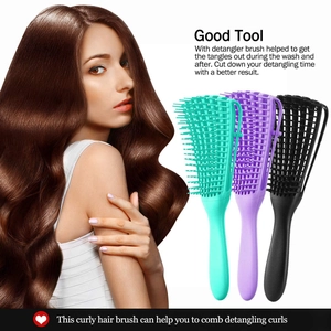 Three flexible detangling brushes in cyan, purple and black for curly hair styling