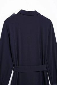 Detail view of the navy blue dress back featuring lapel collar and matching waist belt