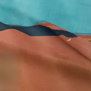 Detailed close-up showing woven texture and blue-red color blocks of the tapestry fabric