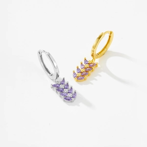 Detailed close-up of leaf-shaped drop earrings with purple marquise stones and metal stems